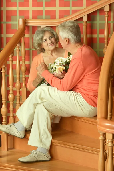 Mature couple on stairs with railing — Stock Photo, Image