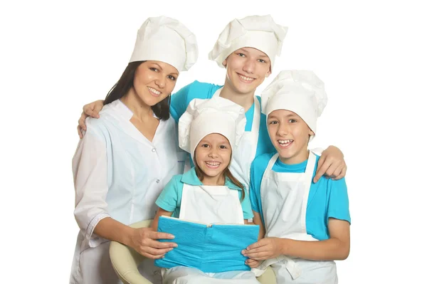 Happy kuchaři s asistenty — Stock fotografie