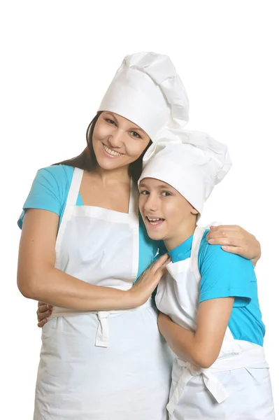 Usmívající se žena kuchař s asistentem — Stock fotografie
