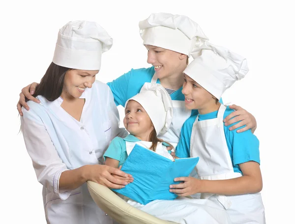 Cheerful chef with assistants — Stock Photo, Image