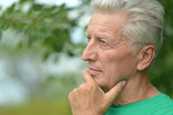 Senior man thinking outddor — Stock Photo, Image