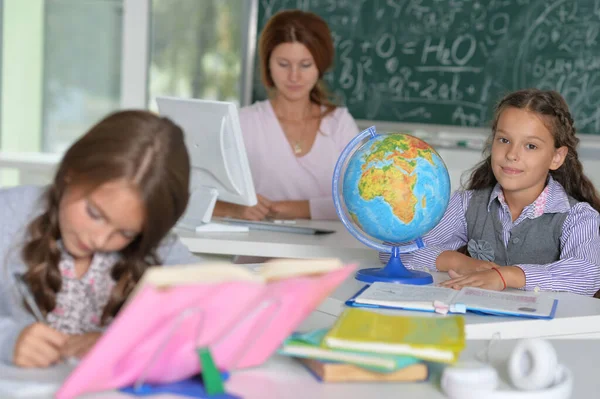 pupils  studying at lesson in class room