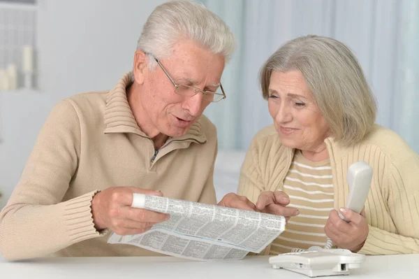 Senior Couple Portrait Newspaper Home — Stock Photo, Image