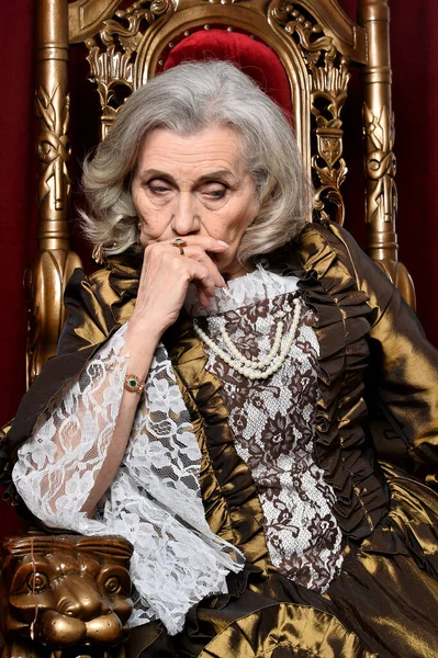 Sad Beautiful Senior Queen Throne — Stok fotoğraf