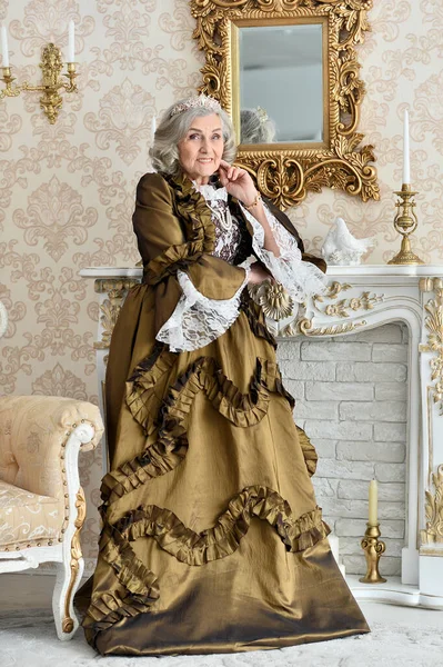 Beautiful Senior Woman Queen Posing Indoors — Fotografia de Stock