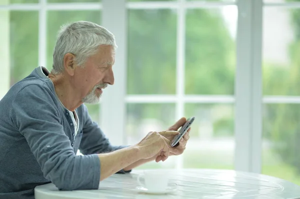 Senior Man Using Phone Home — Stock Photo, Image