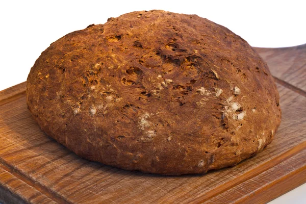 Bread on a wooden board — Stock Photo, Image