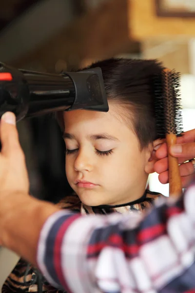 Young boy at barber shop — Stock Photo, Image