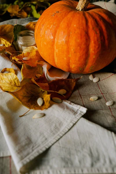 Composition Pumpkin Kitchen Towel Candle Autumn Leaves Table Close View — Stock Photo, Image