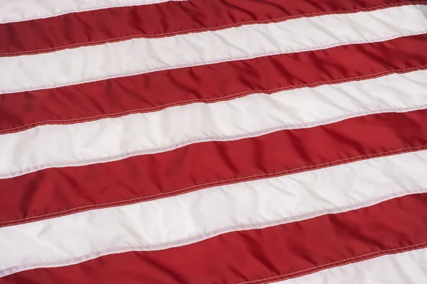 Listras vermelhas e brancas na bandeira americana — Fotografia de Stock