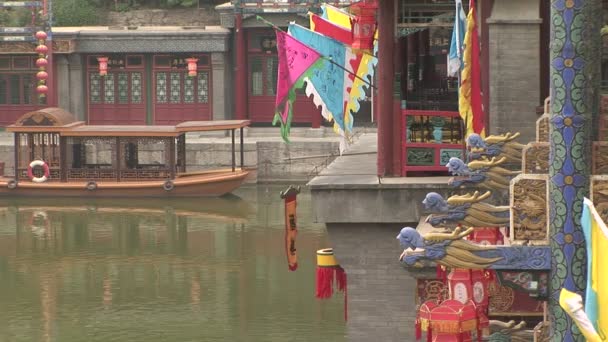 Colorful flags, lanterns, gargoyles and ferry boat on the water — Stock Video