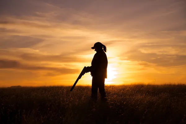 Woman Bird Hunter in Sunset — Stock Image Woman Bird Hunter in Sunset Royalty Free Stock Photos