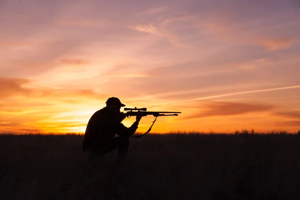 Гвинтівка мисливець на захід сонця Стокова Картинка