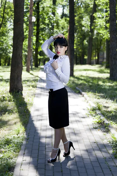 The girl the brunette in a white blouse — Stock Photo, Image