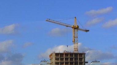Construction crane and sky. Time lapse