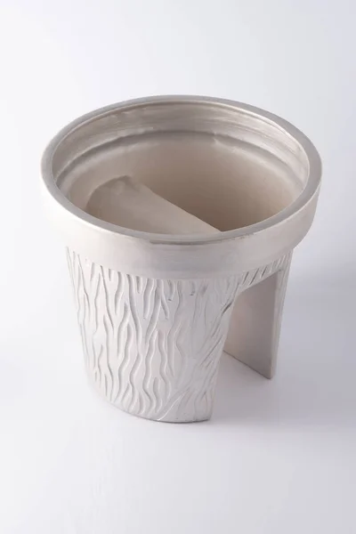 Hanging pot for flowers. Pots on the railing of the balcony. Gray clay pot on a white background. — 스톡 사진