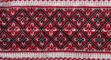 National Ukrainian embroidery. Handmade. Cross stitch in red, black and white. Traditional shirt of Ukraine. Embroider background