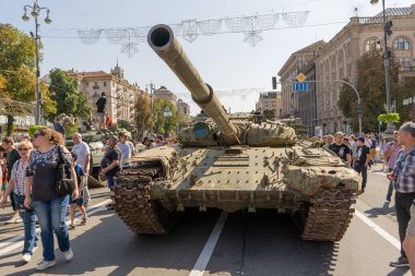Exhibition of destroyed burnt Russian military equipment on Khreschatyk. Tank, armored personnel carrier and Ukrainian people on the street during the war with Russia. Ukraine, Kyiv - August 21, 2022.
