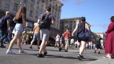 People on Khreshchatyk street. Ukrainians are watching Exhibition of destroyed burnt Russian military equipment. Ukrainian during the war. Russian tank. Summer. Ukraine, Kyiv - August 21, 2022.