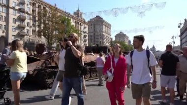 People on Khreshchatyk street. Ukrainians are watching Exhibition of destroyed burnt Russian military equipment. Ukrainian during the war. Russian tank. Summer. Ukraine, Kyiv - August 21, 2022.