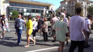 People on Khreshchatyk street. Ukrainians are watching Exhibition of destroyed burnt Russian military equipment. Ukrainian during the war. Russian tank. Summer. Ukraine, Kyiv - August 21, 2022.