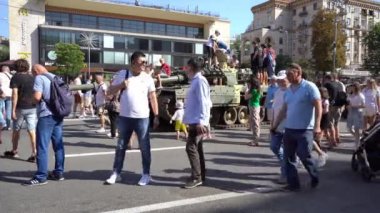 People on Khreshchatyk street. Ukrainians are watching Exhibition of destroyed burnt Russian military equipment. Ukrainian during the war. Russian tank. Summer. Ukraine, Kyiv - August 21, 2022.