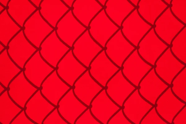 Cień czerwony chainlink ogrodzenia — Zdjęcie stockowe