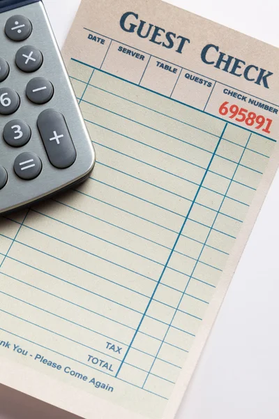 Guest Check and calculator — Stock Photo, Image