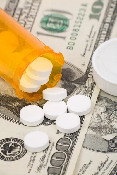 Medicine pills and dollar — Stock Photo, Image