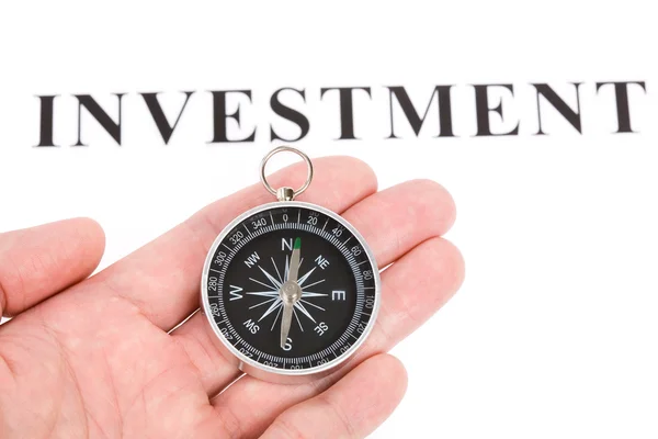 Headline investment and Compass — Stock Photo, Image