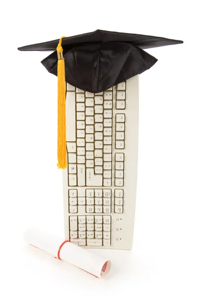 Czarna klawiatura graduacyjnej i komputer — Zdjęcie stockowe