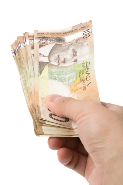 En hand full av kanadensiska dollar — Stockfoto