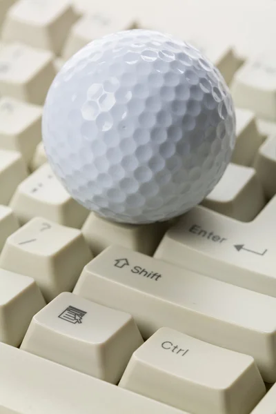 Palla da golf e tastiera Foto Stock