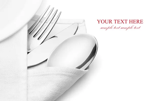 Knife, fork and spoon with linen serviette. — Stock Photo, Image