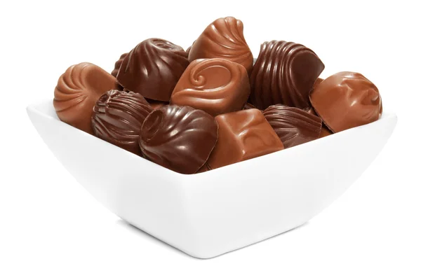 Chocolate sweets in white bowl. — Stock Photo, Image
