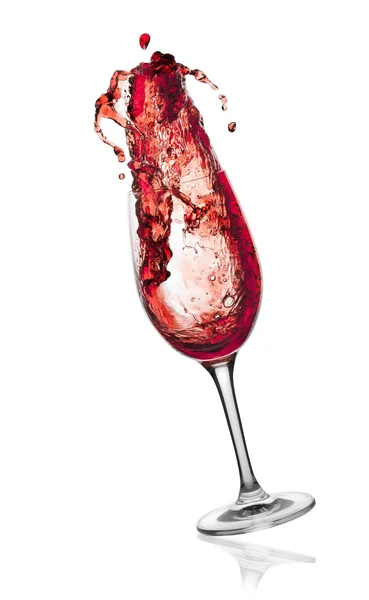 Rotwein spritzt aus Glas. — Stockfoto