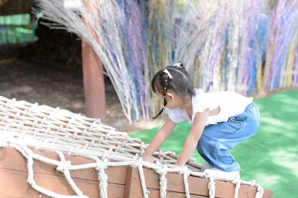 Cute Little Asian Girl Climbing Rope Net Playing Playground Little — Zdjęcie stockowe