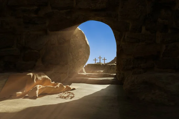Empty tomb of Jesus Christ. Abandoned shroud and crown of thorns on the floor. Light pouring into the cave. 3d render Stock Picture