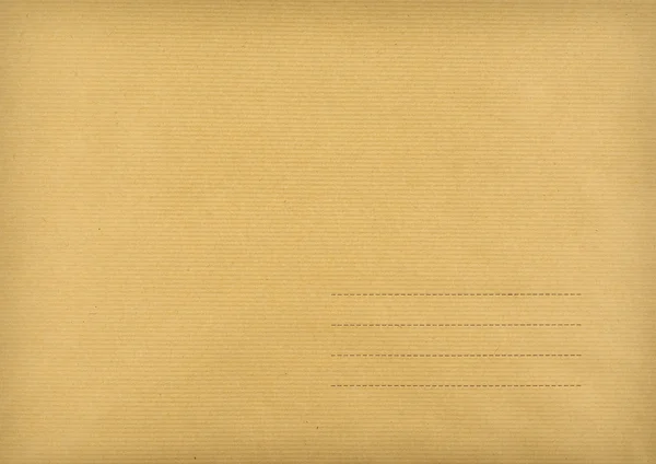 Enveloppe brune faite de papier rayé — Photo