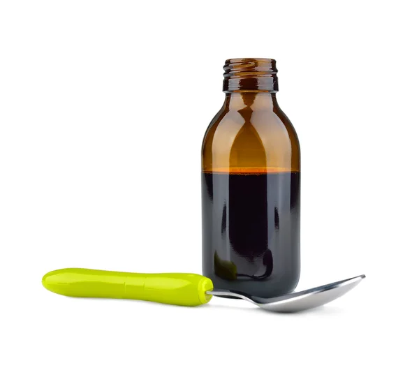 Syrup in a bottle and spoon — Stock Photo, Image