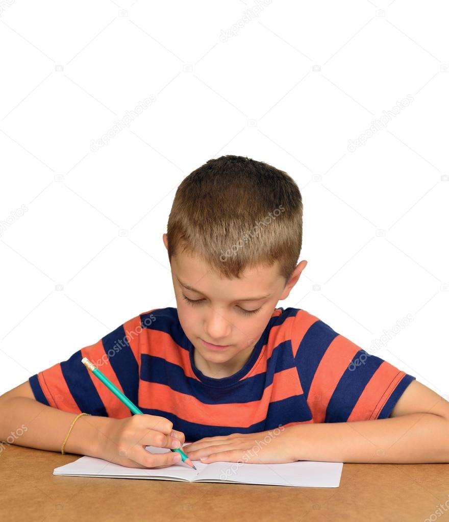 Boy writing in the notebook