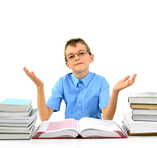 Young boy with open hands and books — Stock Photo, Image