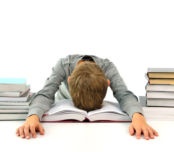 Cansado e entediado menino com livros — Fotografia de Stock