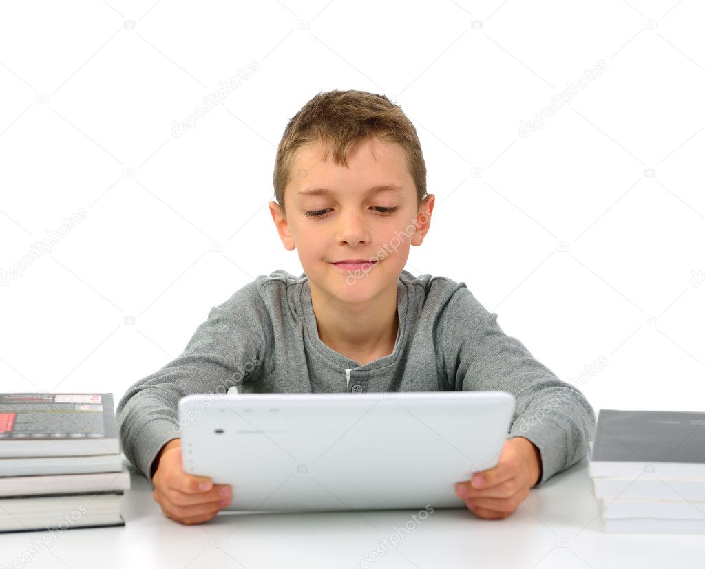 Boy with tablet pc and books