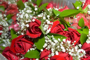 Bridal bouquet. Bouquet of red roses. Wedding preparations.