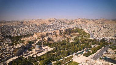 Aerial view of Sanliurfa Castle, rooftops, park around Balikligol and Mevlidi Halil Mosque. Historical and most visited part of Sanliurfa city, southeastern Anatolia, Turkey