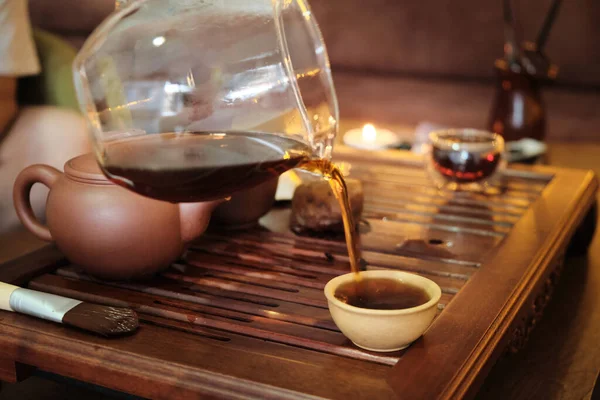 Brewing Puerh Tea Person Pours Tea Glass Teapot Bowl Tea — Photo