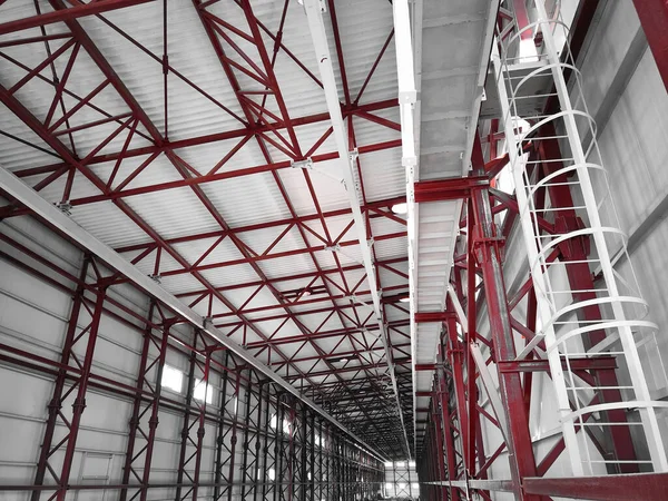 Overhead traveling gantry crane beam, maintenance scaffoldings and truss ceilings of industrial building. Crane runway girder and metal structures