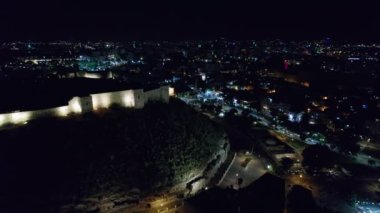 Illuminated Gaziantep Castle and night city lights aerial view