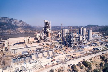 Aerial view of huge cement producing plant located in mountainside